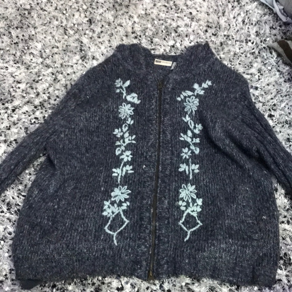 zipped up knitted jacket